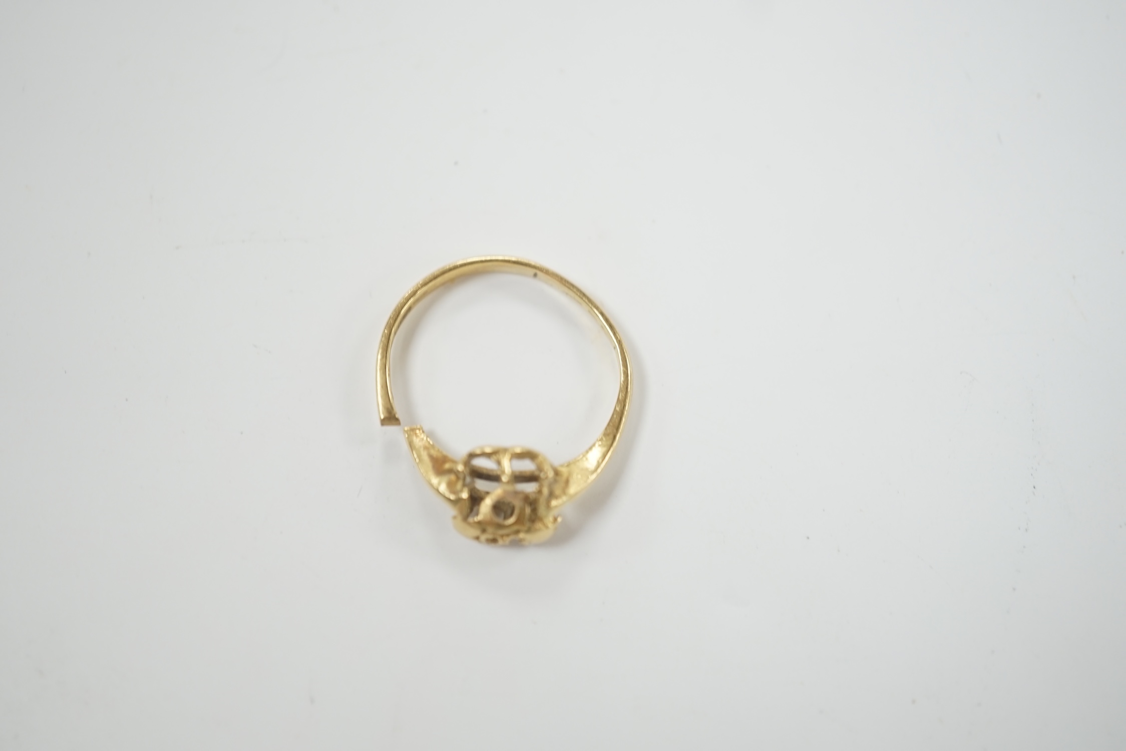 An Italian 750 yellow metal ring shank (cut and misshapen)